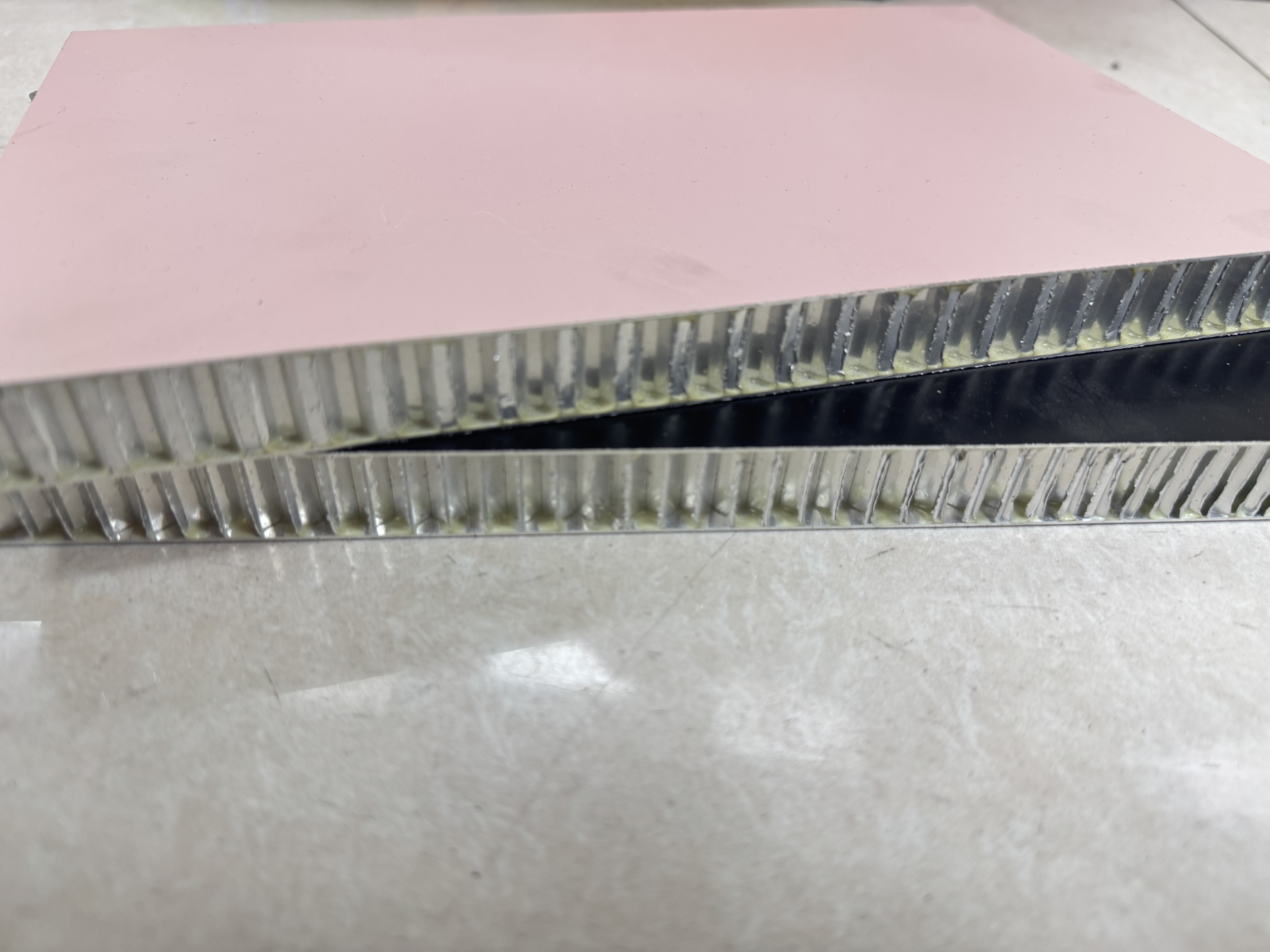Finished honeycomb panel surface
